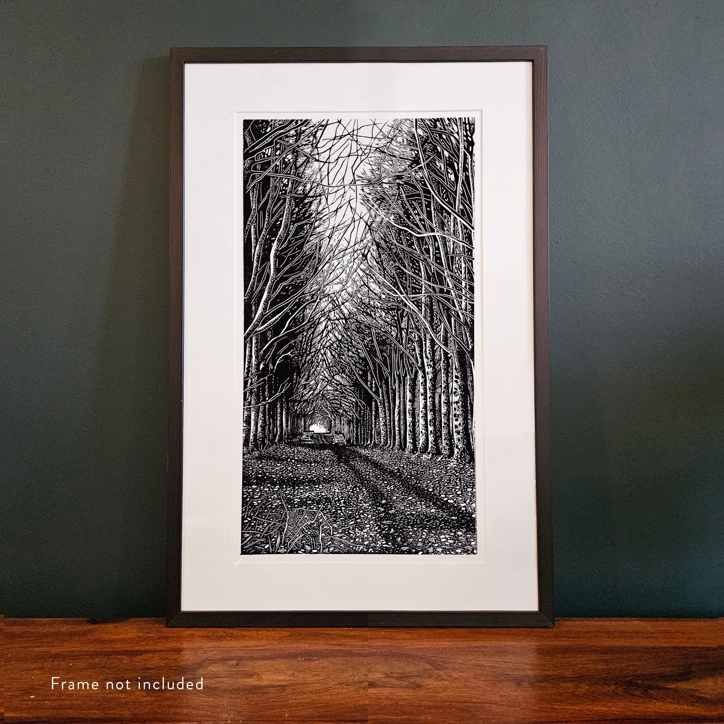 Framed linocut of black and white trees