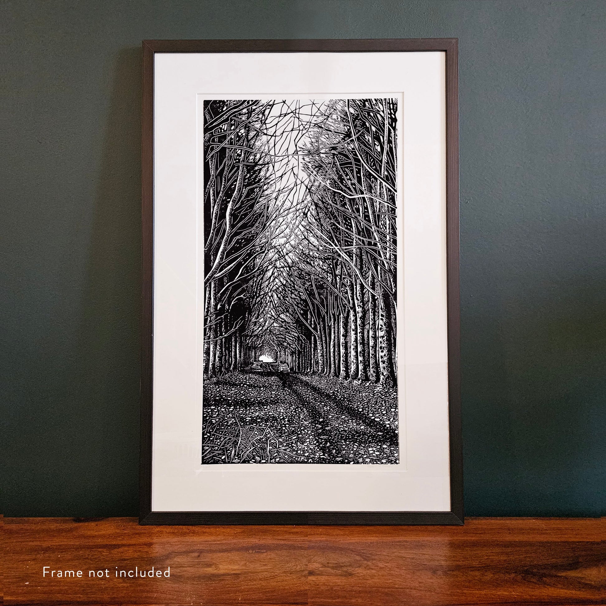 Framed linocut of black and white trees
